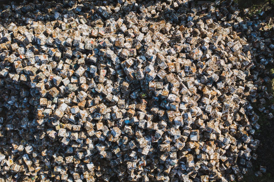 Aerial perspective of densely packed metal scrap cubes in an industrial setting, highlighting recycling.